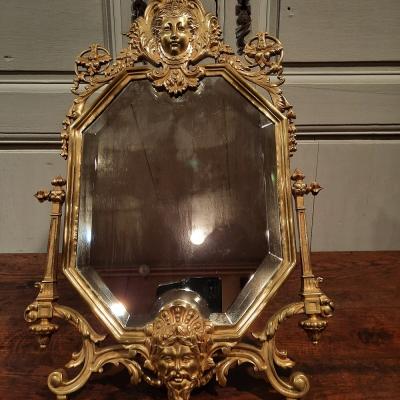 Miroir de salon en bronze de style Régence d’époque XIXème siècle.